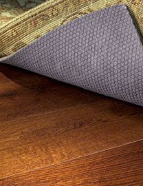 why many rug pads contain adhesives